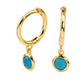 Gold plated huggy earrings with blue stone