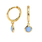 Gold plated huggy earrings with blue stone