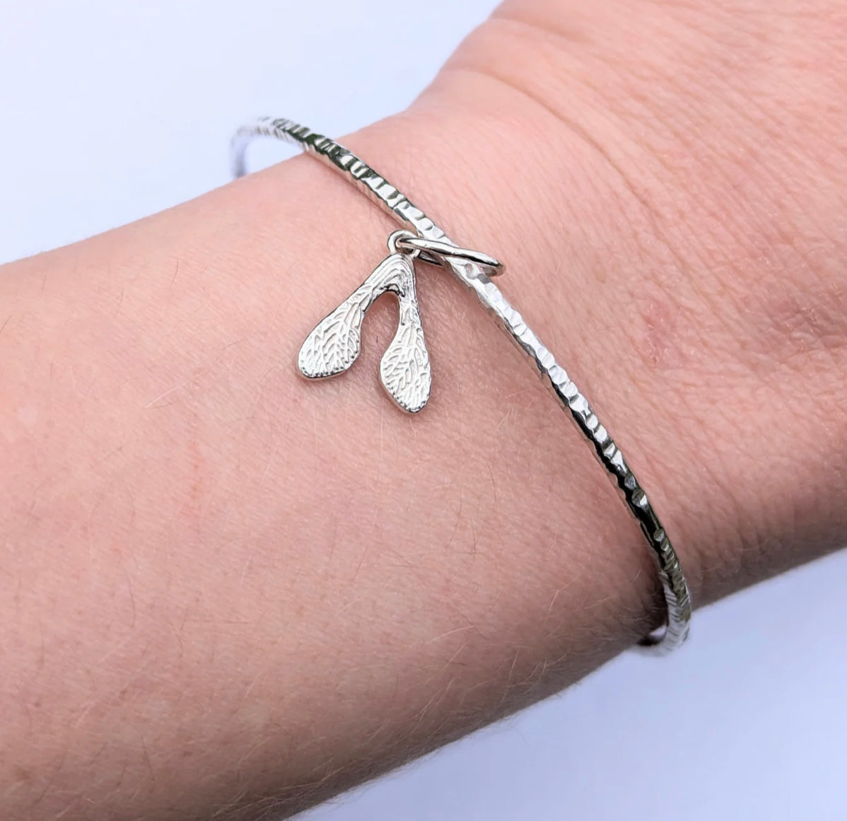 Sterling Silver Textured Bangle with Sycamore seed Charm